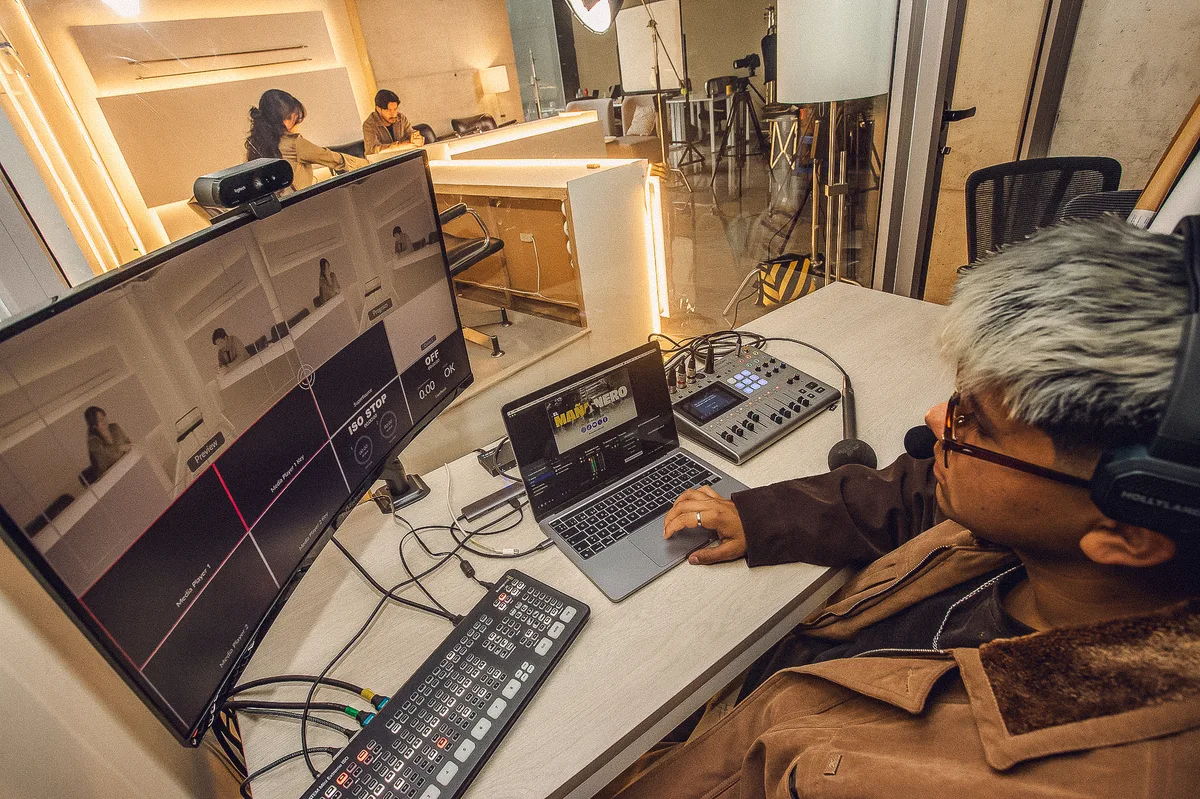 OZ Media Group control room — monitor, ATEM switcher and laptop